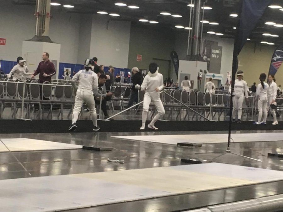 Monica Balakrishnan fencing with her opponent at the convention center. 
