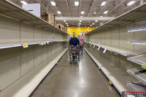 Shoppers find empty shelves and a desolate environment at HEB grocery store.