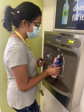 Sophomore Bela Jotwani uses a re-usable water bottle at a CVHS refilling station before cross country practice. 