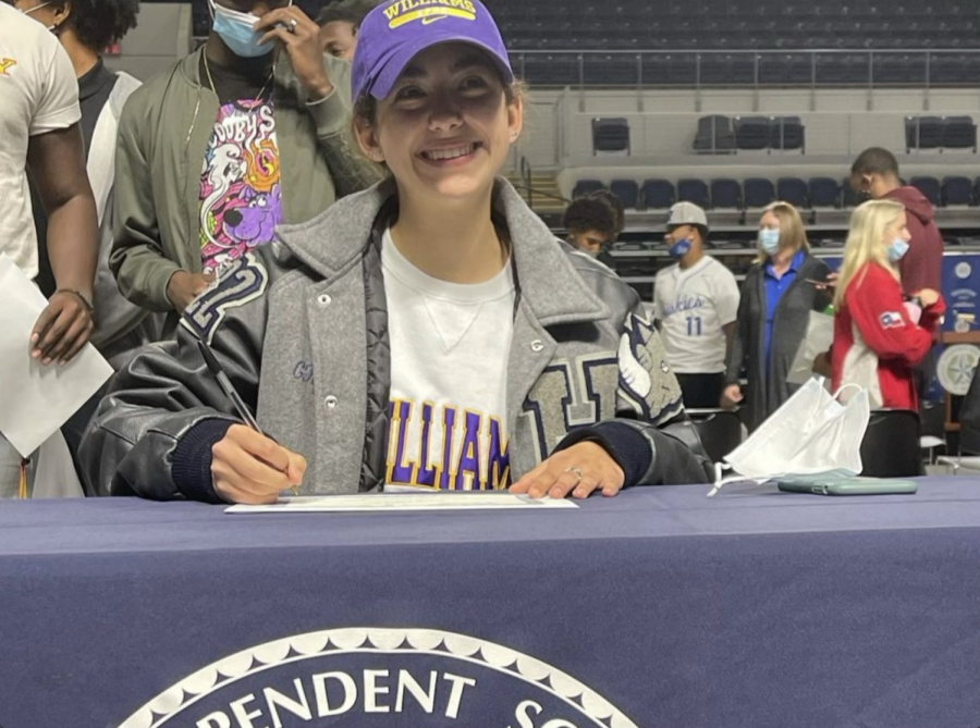 Gabi+Rodriguez+signs+her+letter+of+intent+for+the+Williams+College+track+team.+