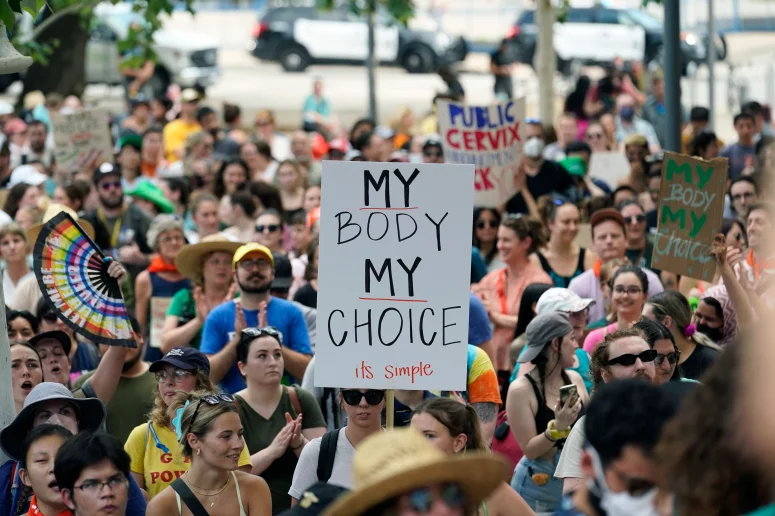 Women and Men rally up to protest the possibility of the overturning of Roe v. Wade in Austin, Texas.
