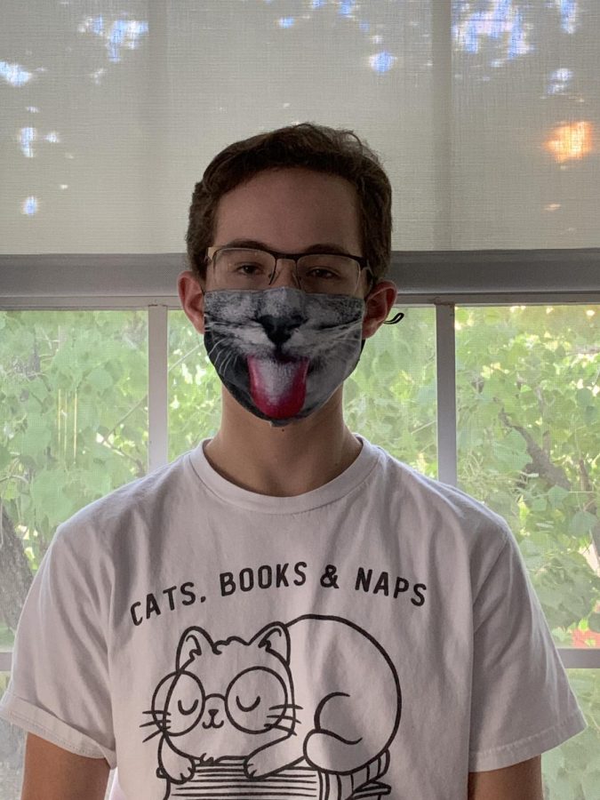 Harris shows off his famous cat mask, paired with another daily cat shirt.
