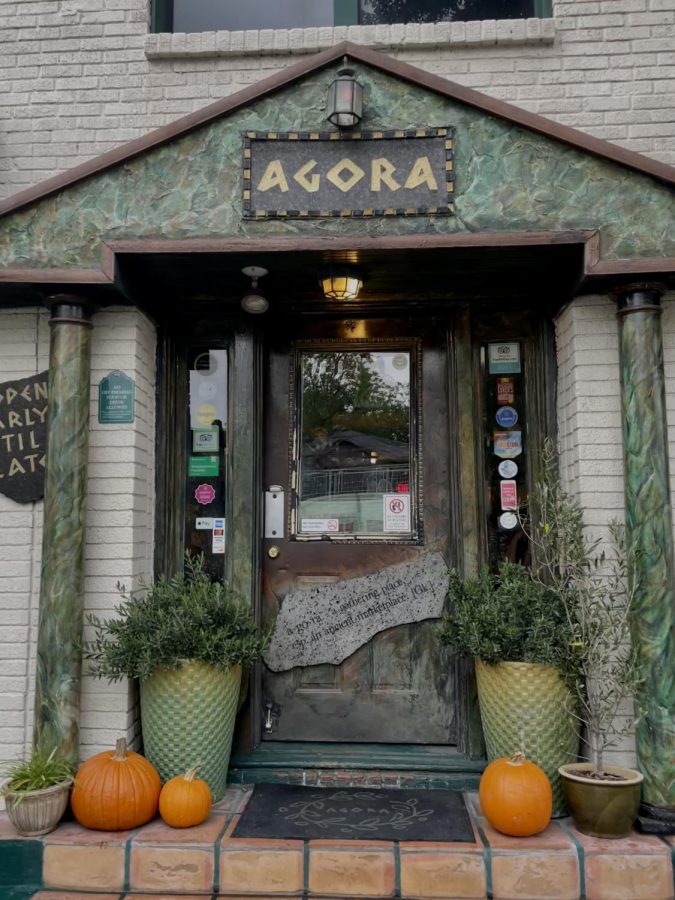 Pumpkins adorn the exterior of the warm building of the coffeeshop Agora.