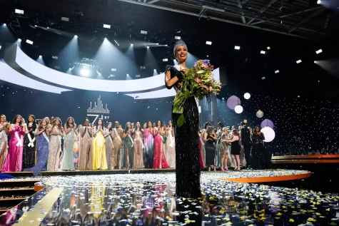 Miss USA after being crowned, with the rest of the contestants behind her