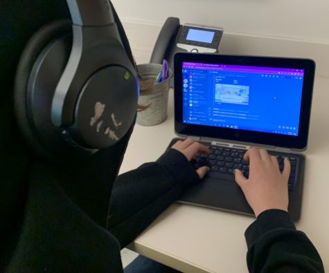 A student clicks away on Discord at school, one of the most popular messaging apps among teenagers.