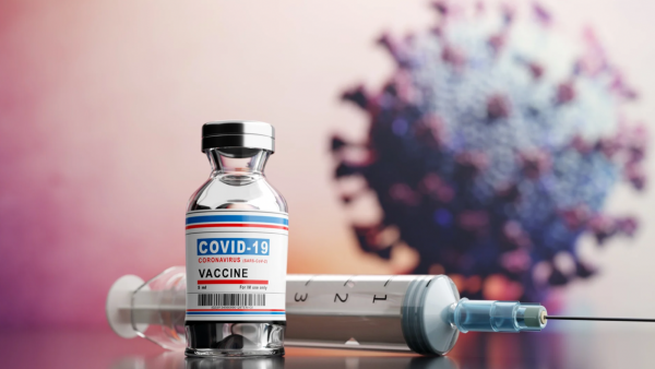 A bottle of COVID-19 vaccine, and a hypodermic needle to administer it. Courtesy of Arizona Department of Health Services