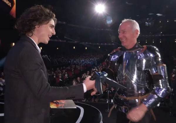 Actor Timothée Chalamet hands the Game of the Year award to Swen Vincke, the founder and CEO of the company behind Baldur's Gate 3. | Image Credit: The Game Awards
