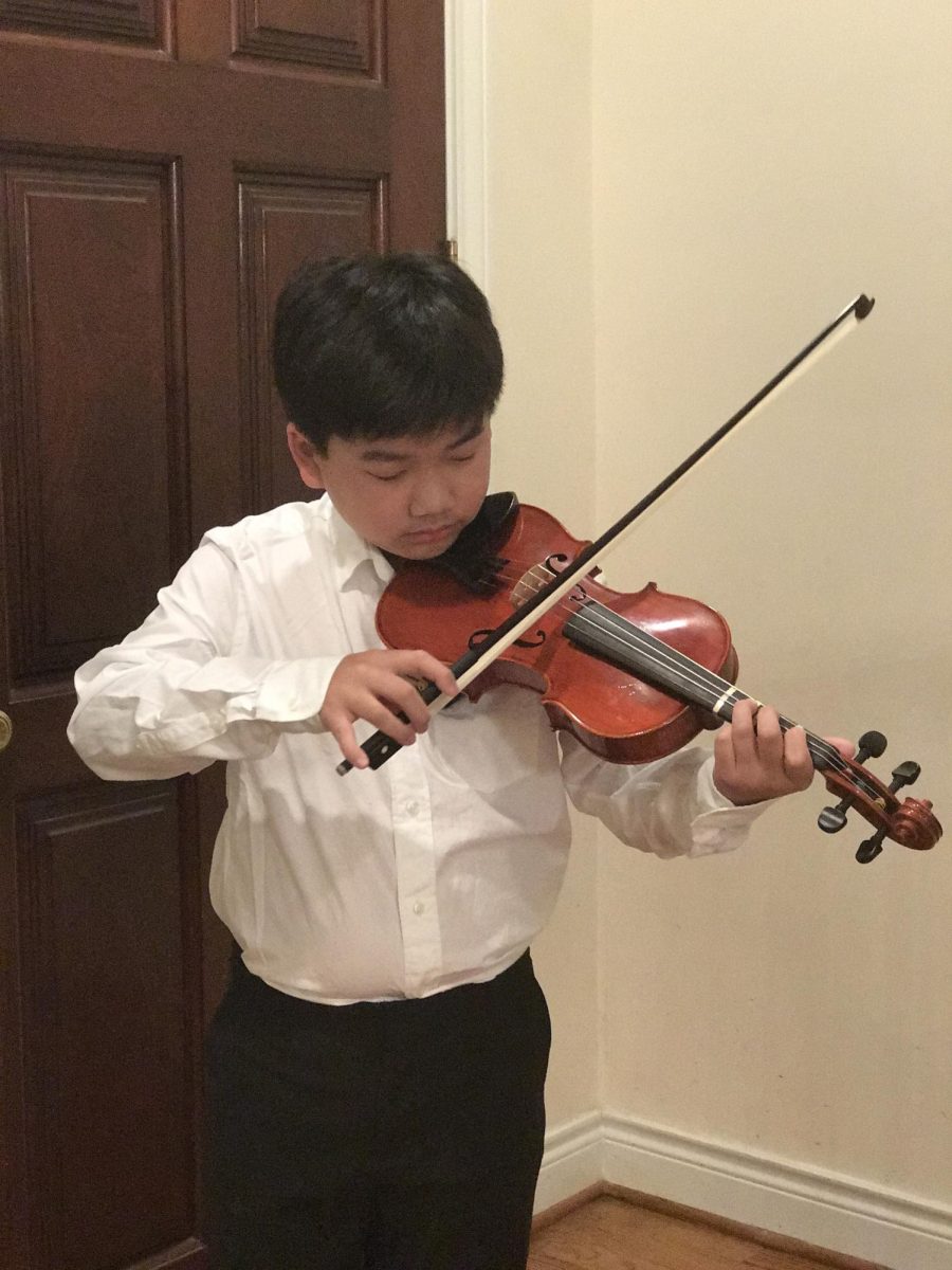 Andrew playing the violin as a 4th grader