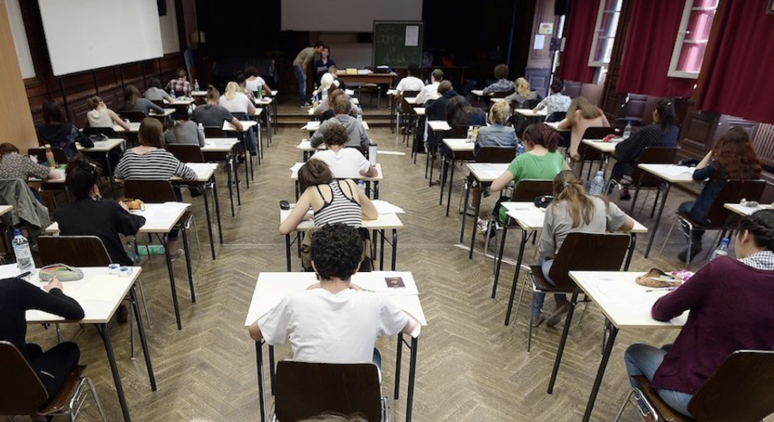 A photo of students test taking, taken from The New Republics In defense of Standardized Tests like the SAT