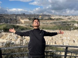 Khaled standing in front of Jerusalem, which he visited as part of Palestines first Youth Advisory Panel