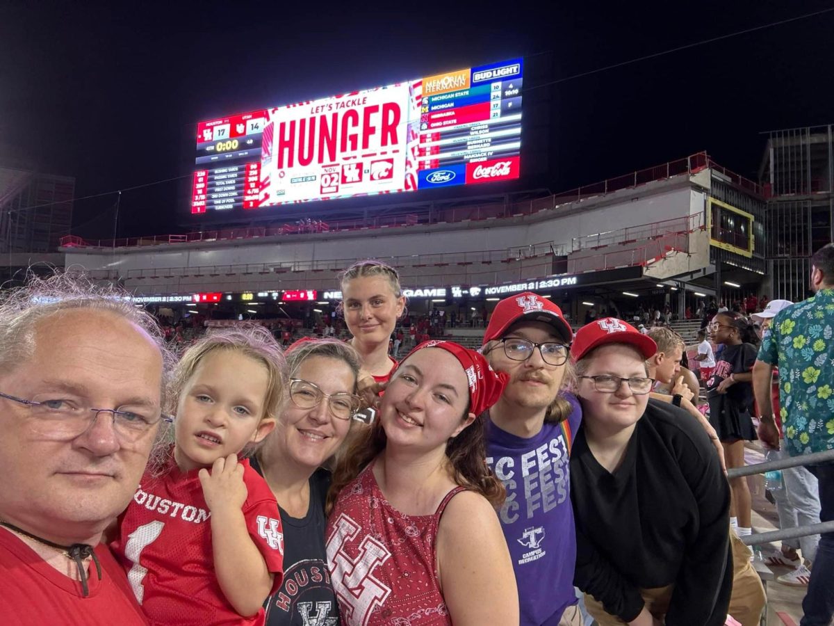Sandra Buso enjoying a University of Houston Cougars game with her family.