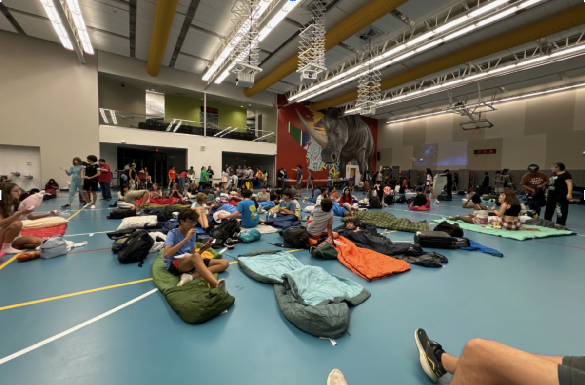 Students in the cafeteria getting ready for movie night at Freshman Lock-In (Esha Bhavsar)