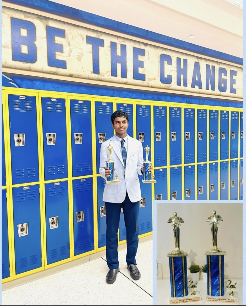 Mohammed poses with his trophies won at the 22nd Elkins HS Debate Tournament.