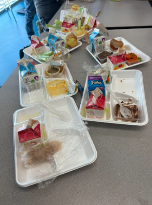 School lunch trash is left on a cafeteria table by CVHS students.