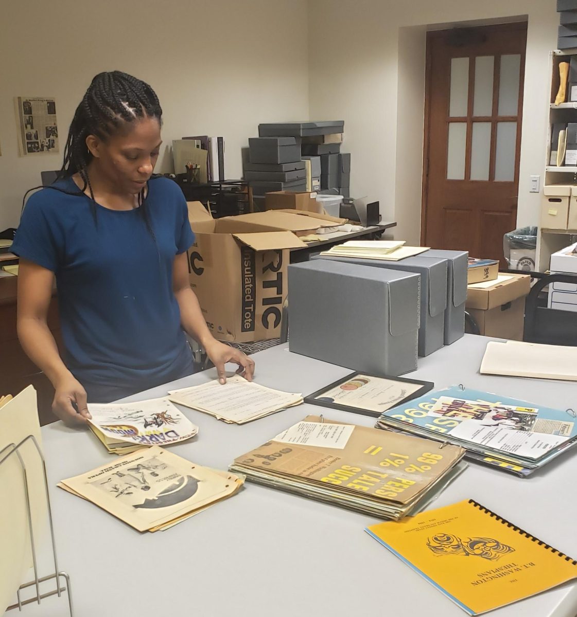 Sheena Wilson in her element of collecting archival pieces and capturing stories. 