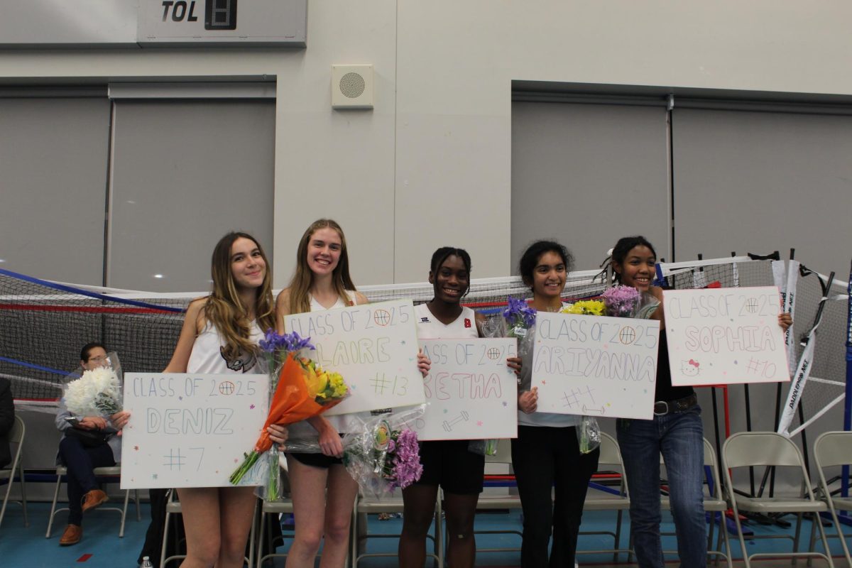 Senior girls Deniz Caliskan, Claire Plante, Aretha CC-Okeke, Ariyanna Thottam, and Sophia Santiuste pose for senior night. 