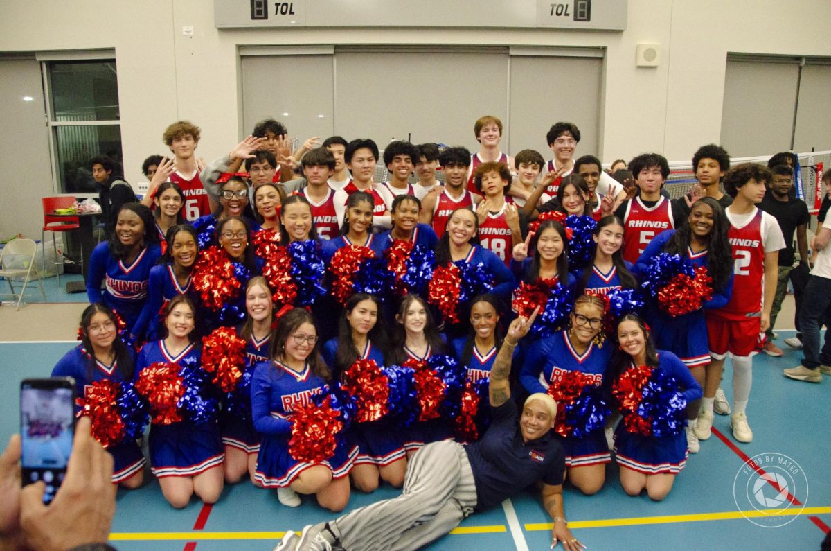 The CVHS Boy's Basketball team and CVHS Cheerleaders post for a picture after the win.