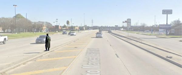 Pedestrian trying to cross a wide road in Houston, Texas.