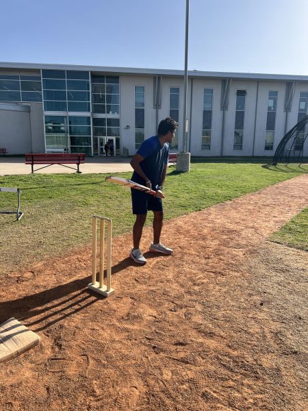 Senior Abhiram Jyousyula practicing his batting after school.