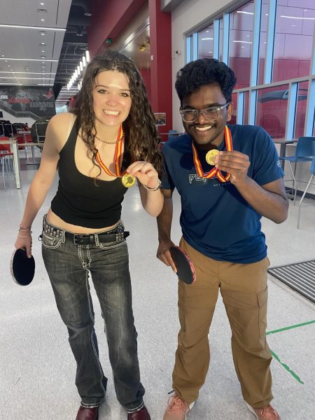CVHS seniors Eva Marsden (left) and Sid Dasari (right) pose with their gold medals at the Bellaire Open Ping Pong Tournament on March 20 at Bellaire High School. The duo won first place in the “consolation” bracket for eliminated teams in the Open Doubles division. (Photo courtesy of Eva Marsden)