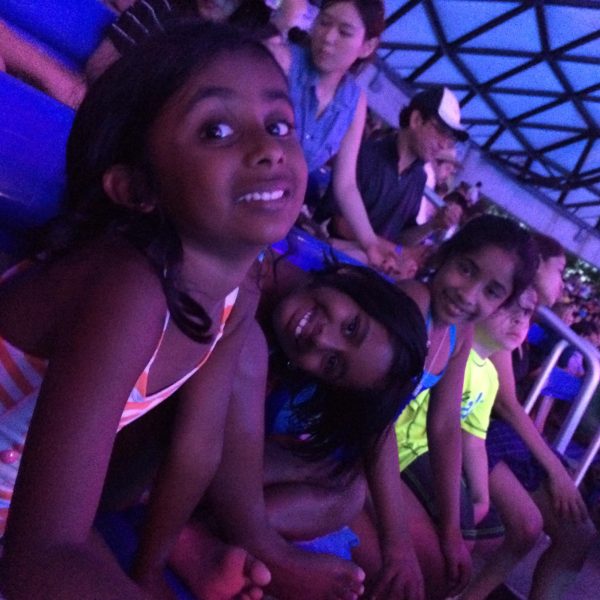 Me (left) with my two sisters when we went to SeaWorld in 2014.