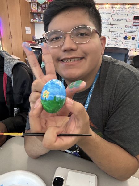 Carnegie Quill club co-president Ivan Salazar with his own painted and personalized egg.